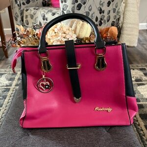 Danbaoly medium faux leather satchel handbag 
Pink and Black Purse with Charm